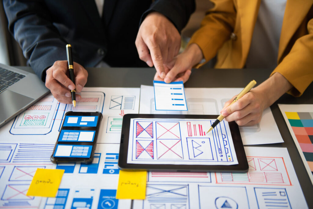 The art of micro-interactions: Enhancing user engagement through subtle animations ux developer and ui designer brainstorming about mobile app int
